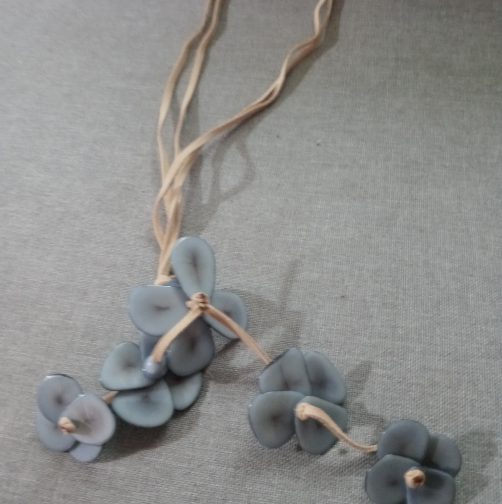 Long tan leather necklace with blue flowers